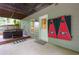 Back patio featuring a hot tub with an entrance and a painted wall with decorative art at 5930 Shannon Drive Dr, Cumming, GA 30040