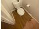 A full white toilet, tan floors, and a small pink rug are featured in the bathroom at 8955 Stonebridge Blvd, Douglasville, GA 30134
