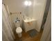 A standard bathroom features light from the windows and a grey rug at 8955 Stonebridge Blvd, Douglasville, GA 30134