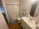 A standard bathroom features light from the windows and a grey rug at 8955 Stonebridge Blvd, Douglasville, GA 30134