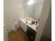 A standard bathroom features light from the windows at 8955 Stonebridge Blvd, Douglasville, GA 30134