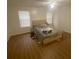 A standard bedroom features light from the windows at 8955 Stonebridge Blvd, Douglasville, GA 30134