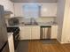 Clean kitchen with stainless steel appliances, white cabinets, and modern sink, ideal for home cooking at 8955 Stonebridge Blvd, Douglasville, GA 30134