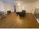 Open living room with wood floors, ceiling fan, and natural light, perfect for entertaining and relaxation at 8955 Stonebridge Blvd, Douglasville, GA 30134