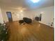 Spacious living room with a ceiling fan, ample natural light, and wood-style flooring, a relaxing and inviting area at 8955 Stonebridge Blvd, Douglasville, GA 30134