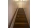 Carpeted stairs with railing lead to the upper level of this lovely home at 8955 Stonebridge Blvd, Douglasville, GA 30134