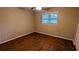 This bedroom features wood look floors and a ceiling fan at 1127 Renee Dr, Decatur, GA 30035