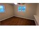 This bedroom features wood look floors, a ceiling fan, and natural light at 1127 Renee Dr, Decatur, GA 30035