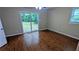 Bedroom with hardwood floors and a sliding glass door to the backyard at 1127 Renee Dr, Decatur, GA 30035