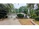 Charming single-story home with a two-car garage and lush landscaping at 1127 Renee Dr, Decatur, GA 30035