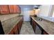 Galley kitchen featuring ample counter space and stainless steel appliances at 1127 Renee Dr, Decatur, GA 30035