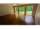 Bright living room with hardwood floors and sliding glass doors leading to the backyard at 1127 Renee Dr, Decatur, GA 30035
