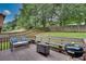 A cozy back deck with built-in seating and barbecue grill overlooks the spacious backyard at 1685 Frazier Park Dr, Decatur, GA 30033