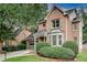 Beautiful brick home with mature landscaping and a welcoming covered front entrance and attached garage at 1685 Frazier Park Dr, Decatur, GA 30033