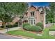 Charming brick home with well-manicured landscaping, attached garage, and inviting front entrance at 1685 Frazier Park Dr, Decatur, GA 30033