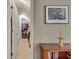 Hallway view of a walk-in closet with clothing racks and shelving and a wooden bookshelf nearby at 1685 Frazier Park Dr, Decatur, GA 30033