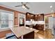 Bright kitchen boasts granite island with seating, stainless appliances, and wooden cabinets under recessed lights at 1685 Frazier Park Dr, Decatur, GA 30033