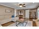 Comfortable living room with hardwood floors, sofa, and a wood shelving unit at 1685 Frazier Park Dr, Decatur, GA 30033