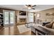 Inviting living room with fireplace, hardwood floors, neutral walls, large windows, and comfortable seating at 1685 Frazier Park Dr, Decatur, GA 30033