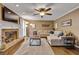 Open living room with a brick fireplace, hardwood floors, and neutral colored walls with comfortable furniture at 1685 Frazier Park Dr, Decatur, GA 30033