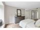 Comfortable bedroom with dresser and large mirror at 17 Ivy Gates Ne, Atlanta, GA 30342