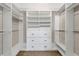Walk-in closet offering ample storage with built-in shelving and drawers at 17 Ivy Gates Ne, Atlanta, GA 30342