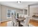 Dining room featuring a large window, hardwood floors, and seating for six at 17 Ivy Gates Ne, Atlanta, GA 30342