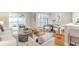 Spacious living area with dining space, modern furnishings, and natural light from windows and patio door at 17 Ivy Gates Ne, Atlanta, GA 30342