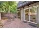 Outdoor patio with brick flooring and a view of the surrounding trees at 17 Ivy Gates Ne, Atlanta, GA 30342