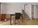 Cozy dining area with wood floors, sliding glass doors, and staircase at 504 Rock Meadow Dr, Stone Mountain, GA 30088