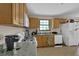 Functional kitchen with granite counters, wooden cabinets, and modern appliances at 504 Rock Meadow Dr, Stone Mountain, GA 30088