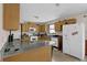 Functional kitchen with granite counters, wooden cabinets, and modern appliances at 504 Rock Meadow Dr, Stone Mountain, GA 30088