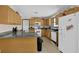 Functional kitchen with granite counters, wooden cabinets, and modern appliances at 504 Rock Meadow Dr, Stone Mountain, GA 30088