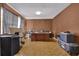 A large office space featuring wood floors, wood paneling, and a large desk at 504 Rock Meadow Dr, Stone Mountain, GA 30088