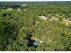 High angle scenic view showcases a house surrounded by lush green trees, offering a sense of privacy and seclusion at 5357 Highway 81, Loganville, GA 30052