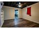 Nicely finished basement area with dark colored floors, recessed lighting, a ceiling fan and open concept at 5357 Highway 81, Loganville, GA 30052