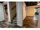 View of basement with wood-look floors, open staircase, open ceiling and many possibilities for use at 5357 Highway 81, Loganville, GA 30052
