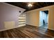 View of open concept basement with open ceiling, painted walls, and access to multiple rooms at 5357 Highway 81, Loganville, GA 30052