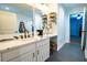 Bright bathroom featuring a double vanity, white cabinets, and a sleek design at 5357 Highway 81, Loganville, GA 30052