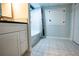 Updated bathroom featuring a stylish vanity with patterned tile floors at 5357 Highway 81, Loganville, GA 30052