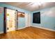 A bright bedroom with hardwood floors, and bathroom access at 5357 Highway 81, Loganville, GA 30052