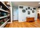 Living area featuring hardwood floors and built-in bookshelves at 5357 Highway 81, Loganville, GA 30052