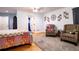 Spacious bedroom featuring hardwood floors, ceiling fan and decorative wall art at 5357 Highway 81, Loganville, GA 30052