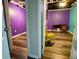 View of colorful bedroom featuring new flooring, with purple and green walls at 5357 Highway 81, Loganville, GA 30052
