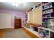 Bedroom with built-in bookshelves and hardwood floors, providing ample storage at 5357 Highway 81, Loganville, GA 30052