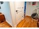 Bedroom featuring hardwood floors with adjoining nook with hanging chair at 5357 Highway 81, Loganville, GA 30052