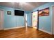 A bright bedroom with hardwood floors and en suite bathroom at 5357 Highway 81, Loganville, GA 30052