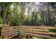 Outdoor deck with built in seating provides a relaxing place to enjoy the surrounding trees at 5357 Highway 81, Loganville, GA 30052