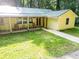 Charming yellow home with covered porch and rocking chairs, perfect for enjoying the outdoors at 5357 Highway 81, Loganville, GA 30052