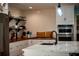 Kitchen with hardwood floors, island, quartz countertops, and stainless steel refrigerator at 5357 Highway 81, Loganville, GA 30052